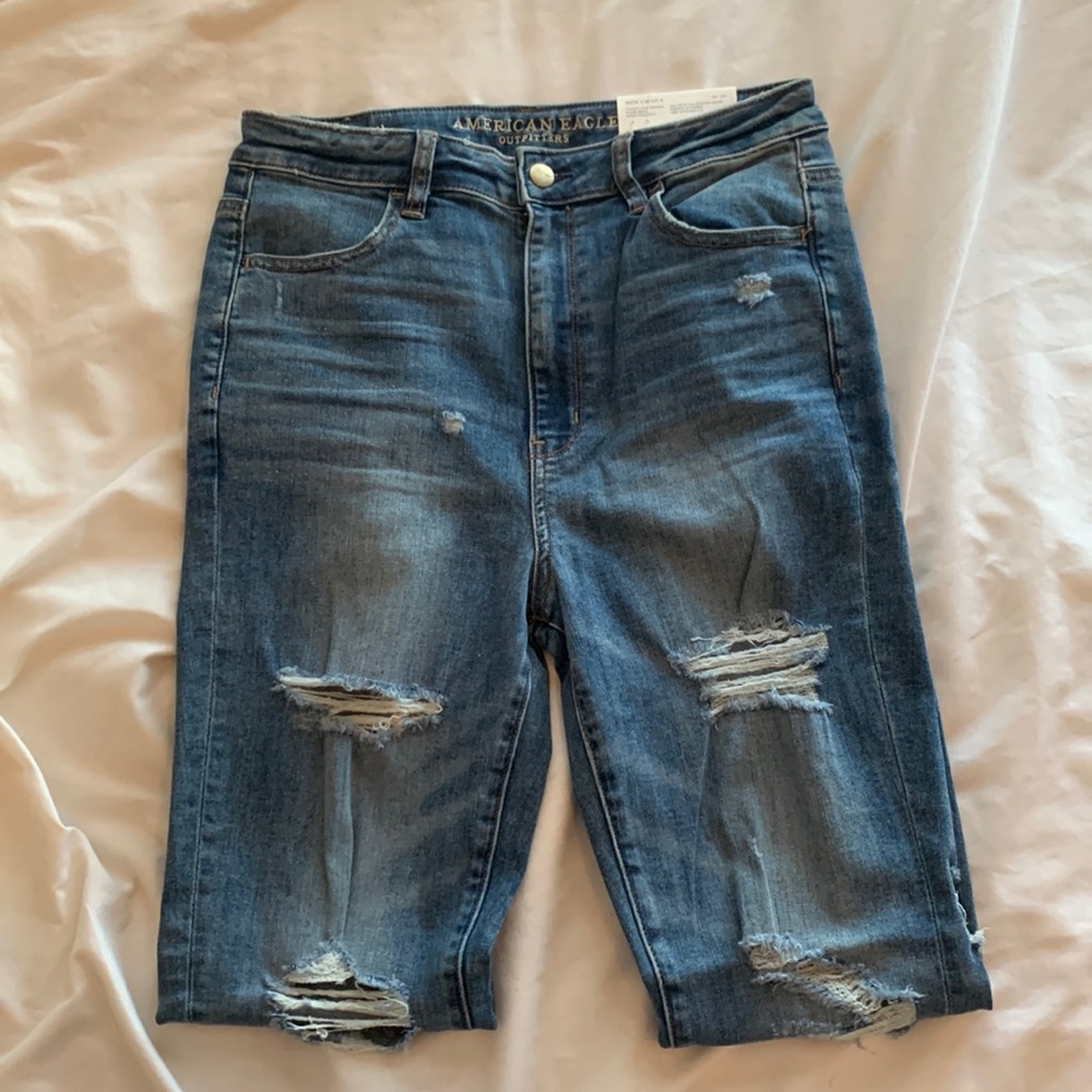 American Eagle distressed raw hem jeans